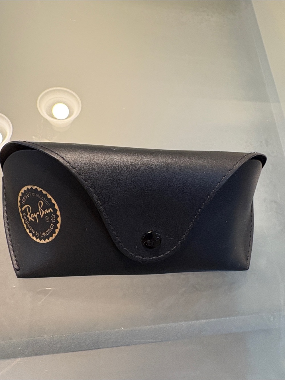 Ray-Ban black sunglasses case with a snap closure, comes with cleaning cloth